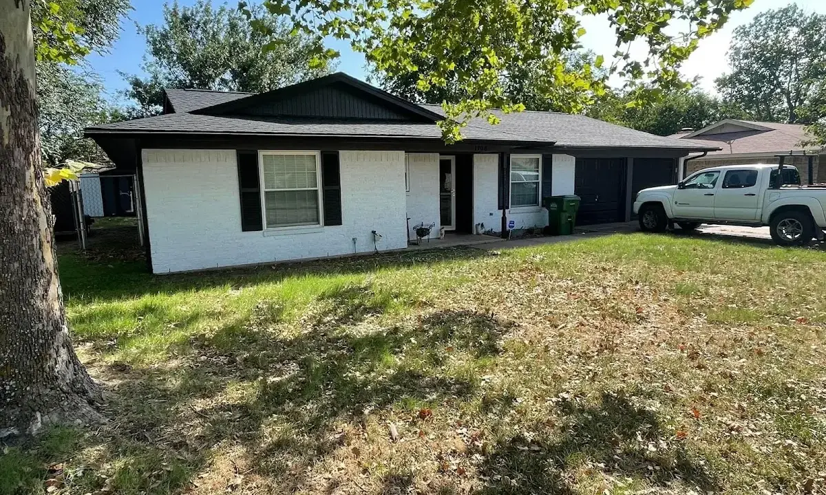 Professional roofing crew working on a residential roof in South San Gabriel
